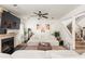 Inviting living area featuring a fireplace, ceiling fan, and an open staircase at 1523 Dillard Rd, Stone Mountain, GA 30088