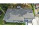 Aerial view of home showing backyard firepit area, roof, driveway, and surrounding landscape at 2254 Glendale Dr, Decatur, GA 30032