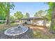 Backyard area boasts a fire pit with stone surround next to a deck, offering outdoor living options at 2254 Glendale Dr, Decatur, GA 30032