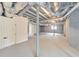 Spacious unfinished basement with painted floor, white walls, and utility access offering renovation potential at 2254 Glendale Dr, Decatur, GA 30032