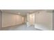 Finished basement area with painted floors, recessed lighting and a doorway with an ajar door at 2254 Glendale Dr, Decatur, GA 30032