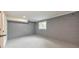 Basement room with painted floors and concrete block wall with a single window at 2254 Glendale Dr, Decatur, GA 30032
