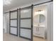 Bathroom with modern sliding barn doors leading to a vanity and a sink at 2254 Glendale Dr, Decatur, GA 30032
