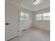 Bright bedroom with two windows allowing natural light, white walls, and light wood floors at 2254 Glendale Dr, Decatur, GA 30032