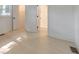 Bright bedroom with hallway, closet, and bathroom access, complemented by white walls and light wood floors at 2254 Glendale Dr, Decatur, GA 30032