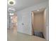 Bright entryway with modern chandelier, hallway view to kitchen, and basement access at 2254 Glendale Dr, Decatur, GA 30032