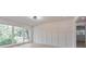 Bright, spacious living room featuring modern wainscoting and large windows at 2254 Glendale Dr, Decatur, GA 30032