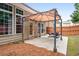 Backyard patio featuring covered table and chairs, and close proximity to house entrance at 320 Roland Manor Dr, Dacula, GA 30019