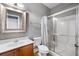 Bathroom features single sink vanity and shower with glass doors at 320 Roland Manor Dr, Dacula, GA 30019