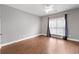 Comfortable bedroom features hardwood floors and ample natural light at 320 Roland Manor Dr, Dacula, GA 30019
