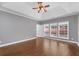 Bedroom features wood floors, trey ceiling, and a wall of windows at 320 Roland Manor Dr, Dacula, GA 30019