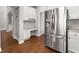 Spacious kitchen with modern appliances and a convenient workstation at 320 Roland Manor Dr, Dacula, GA 30019