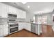 Stylish kitchen featuring stainless steel appliances and a functional island at 320 Roland Manor Dr, Dacula, GA 30019