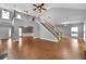 Open concept living room with soaring ceilings and wood floors at 320 Roland Manor Dr, Dacula, GA 30019