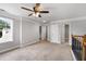 Open loft area with multiple doorways and a bright window at 320 Roland Manor Dr, Dacula, GA 30019
