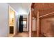 Unfinished attic space with a closet, window, and space for renovations at 3261 N Fulton Ave, Atlanta, GA 30354