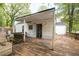 The back porch includes an expansive wooden deck and a covered shelter with access to the home at 3261 N Fulton Ave, Atlanta, GA 30354