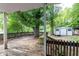 The back porch features a wooden deck and a view of the expansive backyard, complete with a storage shed at 3261 N Fulton Ave, Atlanta, GA 30354