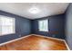 Bedroom with hardwood floors and windows at 3261 N Fulton Ave, Atlanta, GA 30354
