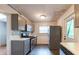 Kitchen featuring stainless steel appliances, gray cabinets, and tile backsplash at 3261 N Fulton Ave, Atlanta, GA 30354