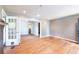 Hardwood floors flow through an open layout in the living room, flooded with natural light at 3261 N Fulton Ave, Atlanta, GA 30354