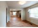 Open living room with hardwood floors, fireplace, and plenty of natural light at 3261 N Fulton Ave, Atlanta, GA 30354