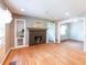 Open living room features hardwood floors, fireplace, and a view of adjacent rooms at 3261 N Fulton Ave, Atlanta, GA 30354