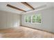 Bedroom with natural light, hardwood floors, decorative trim, and exposed beams at 370 Chicopee Dr, Marietta, GA 30064