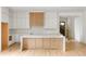 Bright, modern kitchen with a large island, custom cabinetry, and a seamless design into the living area at 370 Chicopee Dr, Marietta, GA 30064