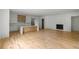 Open-concept space with hardwood floors, a kitchen with an island, and a cozy fireplace, perfect for entertaining at 370 Chicopee Dr, Marietta, GA 30064