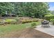 A backyard view displays a garden bed, patio set, and retaining wall at 3765 Peachbluff Ct, Duluth, GA 30097