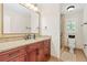 Elegant bathroom with a granite vanity, large mirror, and a separate glass-enclosed shower at 3765 Peachbluff Ct, Duluth, GA 30097