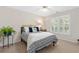 Inviting bedroom with plantation shutters, ceiling fan, and a cozy bed at 3765 Peachbluff Ct, Duluth, GA 30097