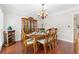 Elegant dining room featuring hardwood floors, traditional furnishings, and a stylish chandelier at 3765 Peachbluff Ct, Duluth, GA 30097