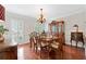 Elegant dining room featuring hardwood floors, traditional furnishings, and natural light at 3765 Peachbluff Ct, Duluth, GA 30097