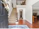 Inviting foyer with hardwood floors, staircase, and elegant entryway, and view to the formal living area at 3765 Peachbluff Ct, Duluth, GA 30097