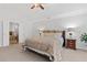 A lovely carpeted main bedroom boasts double doors and an ensuite bathroom at 3765 Peachbluff Ct, Duluth, GA 30097