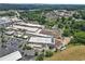 Aerial view showcases the building's expansive parking lot, convenient for tenants and customers alike at 42 Riverdale St, Canton, GA 30114
