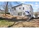 Exterior view of home highlighting backyard, patio, and covered parking at 42 Riverdale St, Canton, GA 30114