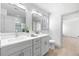 Bright bathroom featuring double sink vanity, gray cabinets and modern finishes and fixtures at 42 Riverdale St, Canton, GA 30114