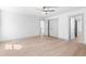 Bedroom with hardwood floors, a ceiling fan, and closet doors, offering a welcoming feel at 42 Riverdale St, Canton, GA 30114