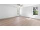 Spacious bedroom with hardwood floors, large windows, offering a bright and airy feel at 42 Riverdale St, Canton, GA 30114