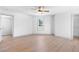 Spacious bedroom with light wood floors, a modern ceiling fan, and natural light at 42 Riverdale St, Canton, GA 30114