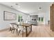 Open-concept dining area with hardwood floors and a view to the living room at 42 Riverdale St, Canton, GA 30114