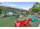 Spacious outdoor event space with picnic tables, lounge chairs, and a projection screen for gatherings at 42 Riverdale St, Canton, GA 30114