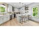 Updated kitchen with stainless steel appliances, bar seating, and hardwood floors at 42 Riverdale St, Canton, GA 30114