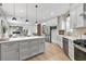 Bright eat-in kitchen with stainless steel appliances, island, and hardwood flooring at 42 Riverdale St, Canton, GA 30114