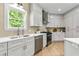 Bright and modern kitchen with stainless steel appliances and ample counter space at 42 Riverdale St, Canton, GA 30114