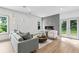 Cozy living room with a modern fireplace, sleek furniture, and a hardwood floor at 42 Riverdale St, Canton, GA 30114