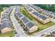 Aerial view of a neighborhood with well-maintained townhomes and green spaces at 771 Tulip Poplar Way, Lawrenceville, GA 30044
